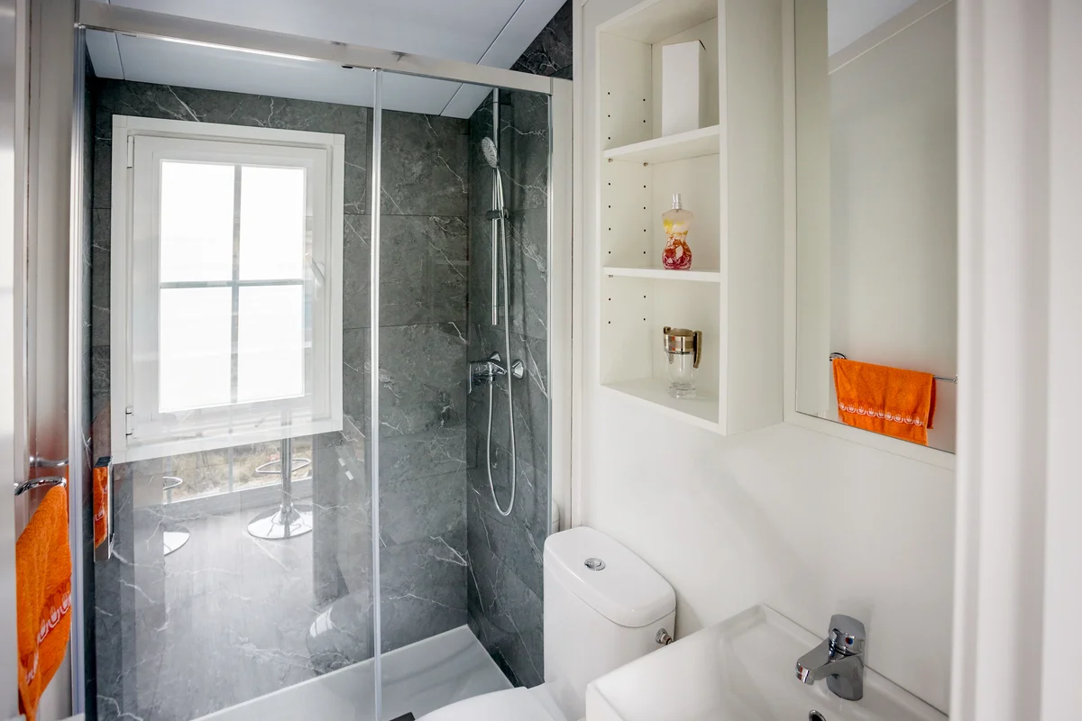 Small bathroom with cabinet over the toilet