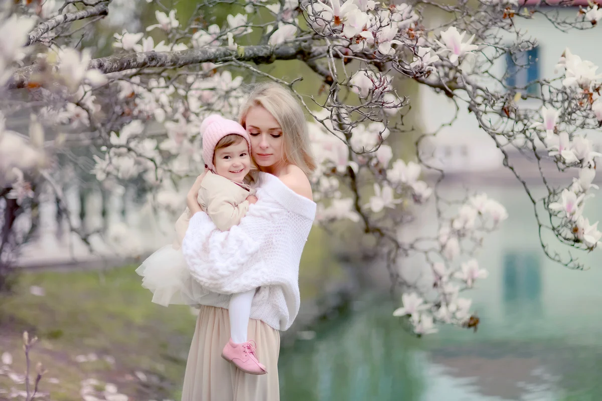 Little girl and mother portrait with flowers