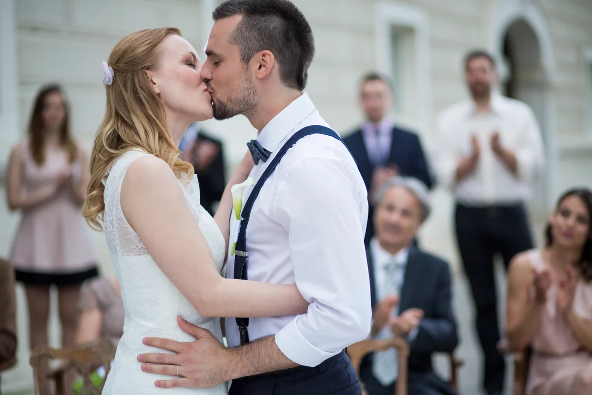 Couple kissing at altar