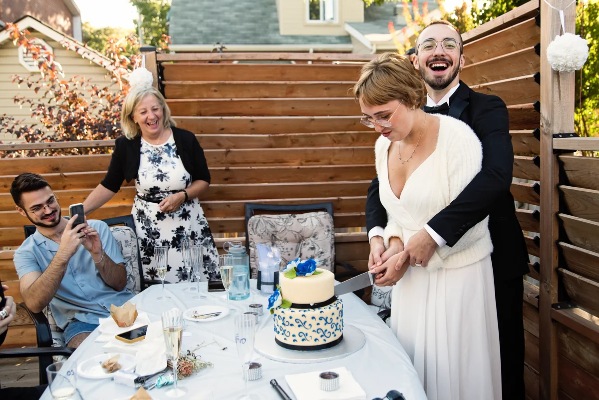 Couple cutting wedding cake