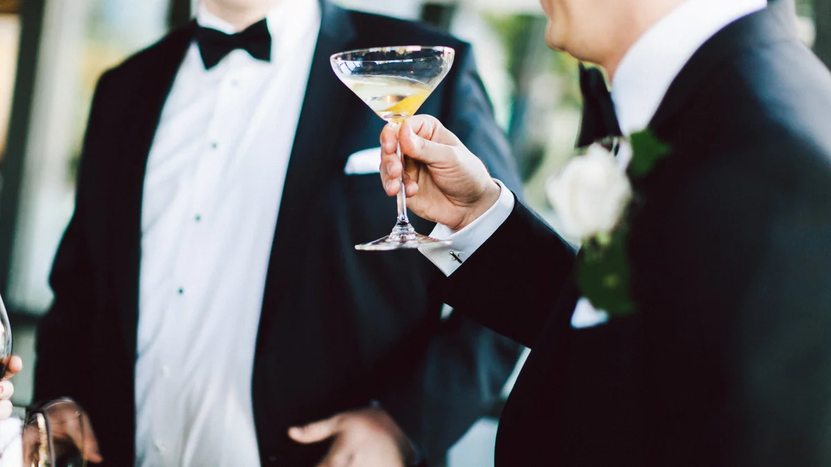 closeup of man in tuxedo holding a drink