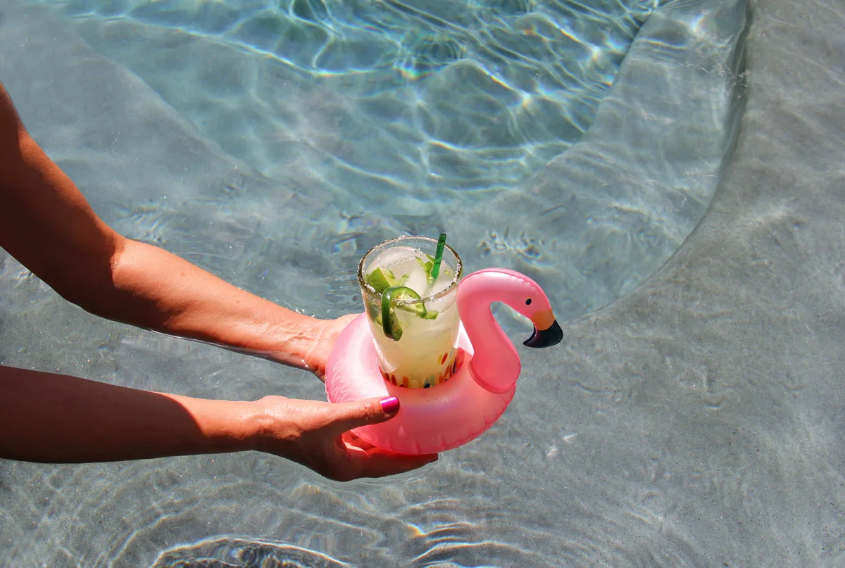 Cocktail in a flamingo pool float