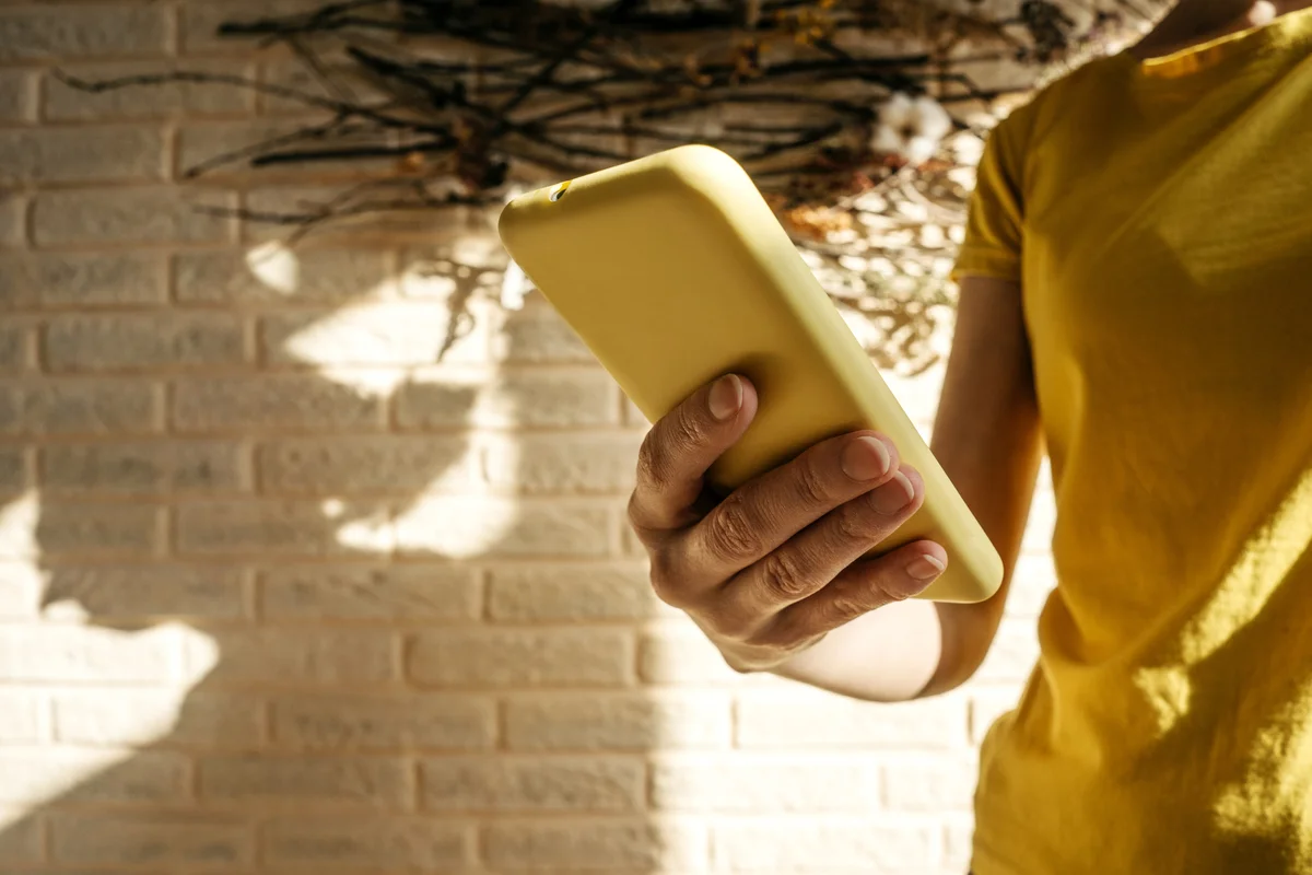 woman holding a cell phone