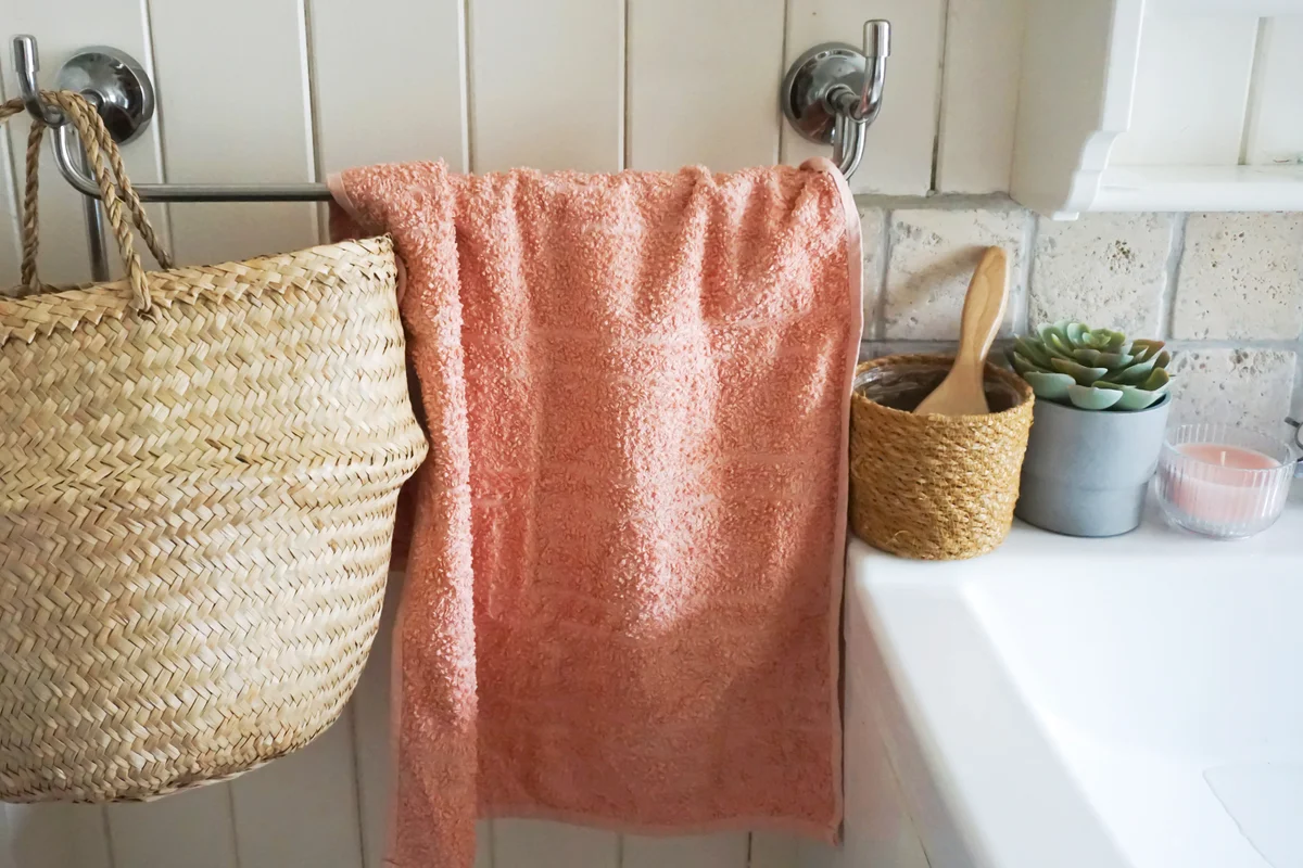 Wicker basket hanging on bathroom