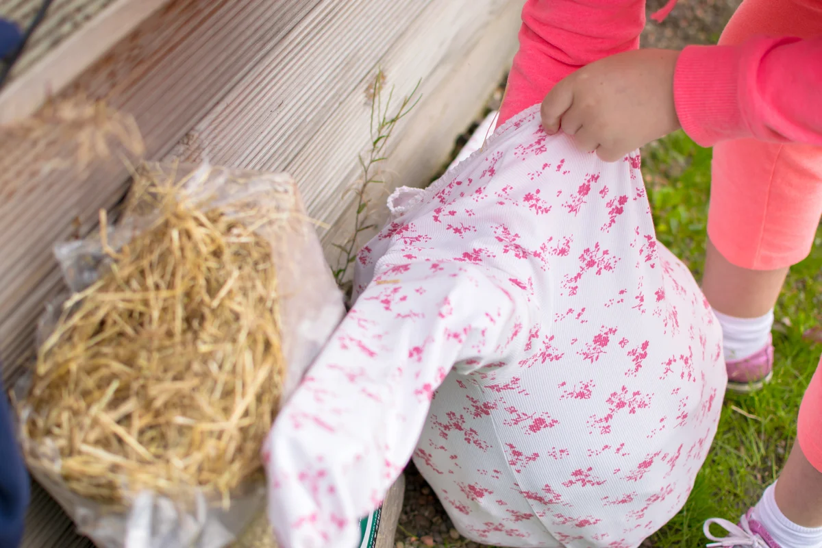 Girl Making Scarecrow