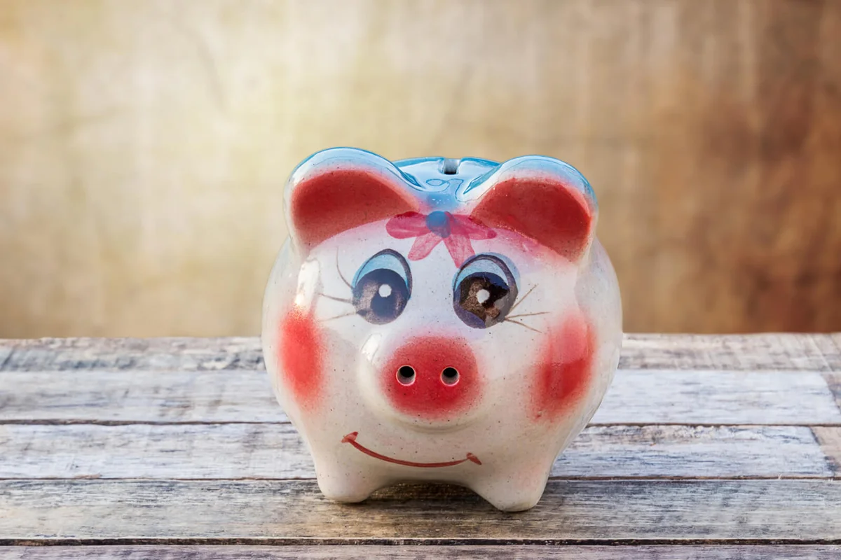Piggy bank on wooden table