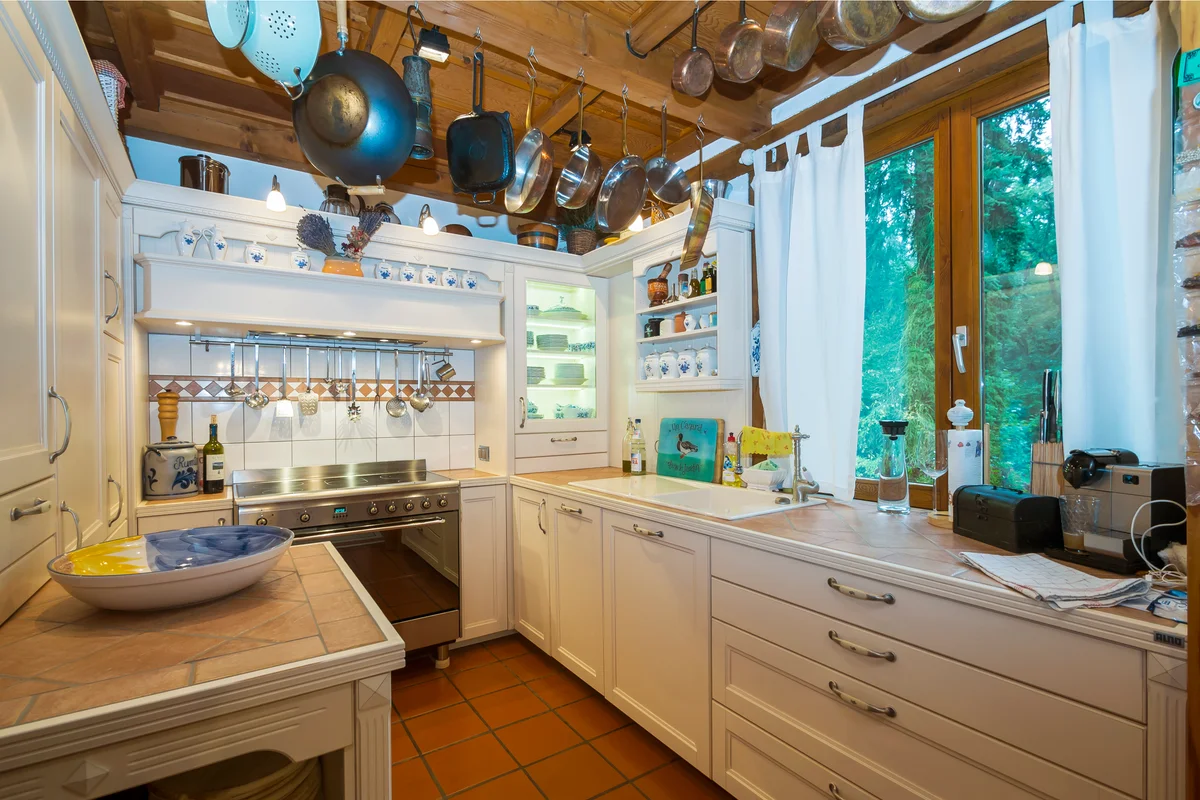 County style kitchen with pots and pan hanged extra high