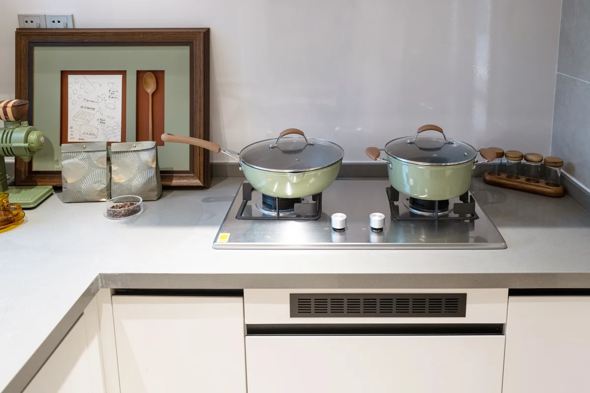 Green pots on kitchen stove