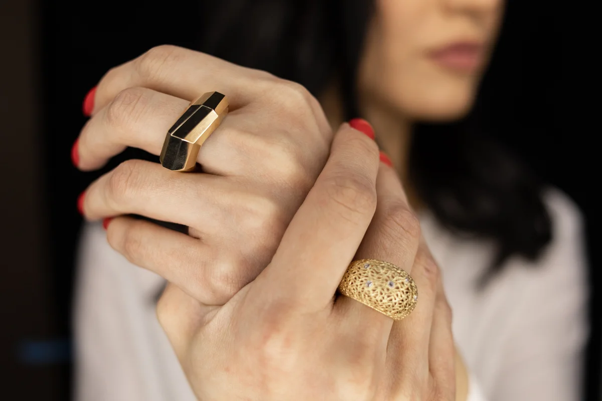 woman with rings on her middle fingers