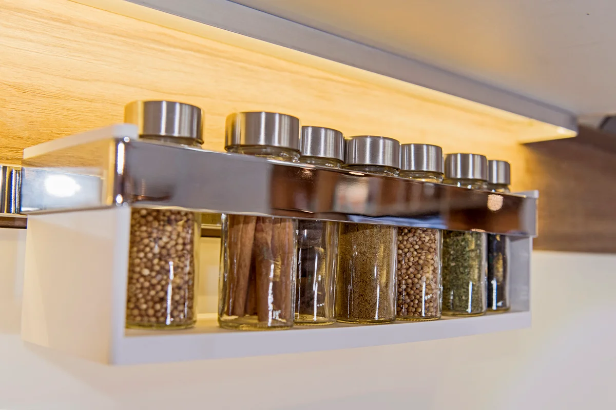 Spice jars on a wall rack