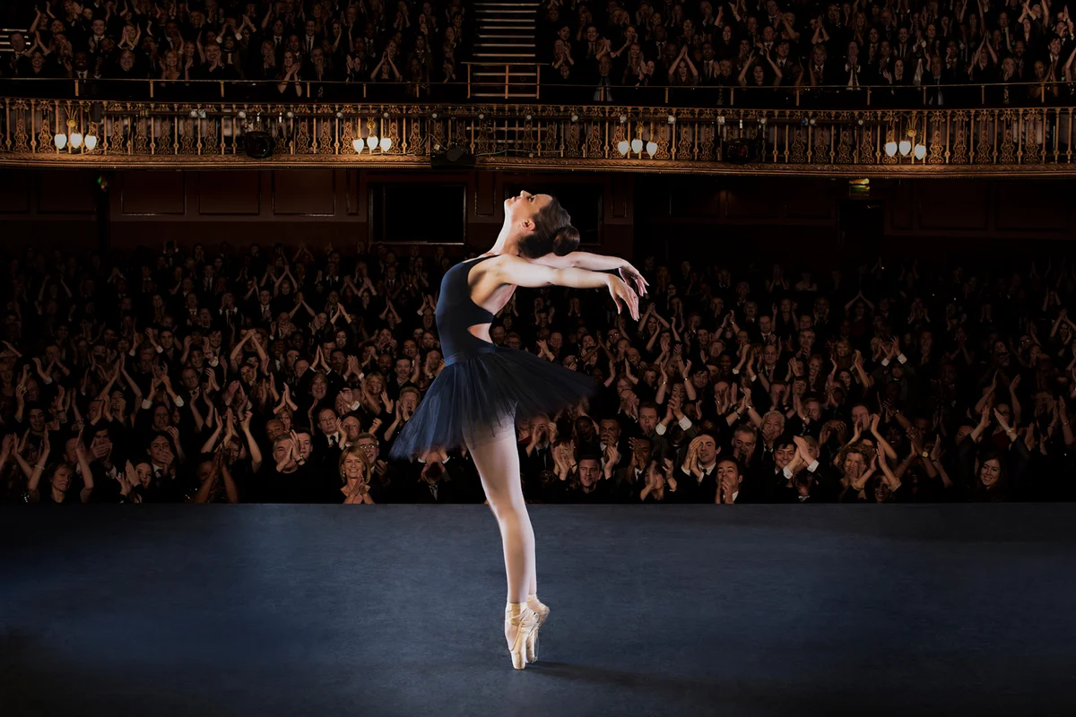 Ballerina performing on stage in theater