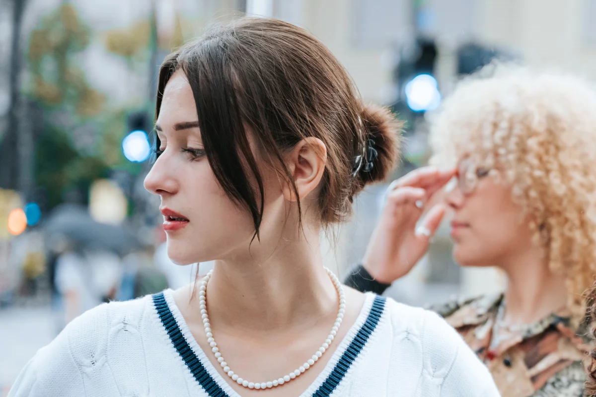 woman wearing pearl necklace