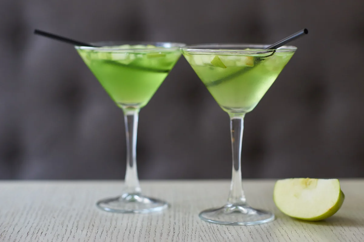 pair of sour apple martinis
