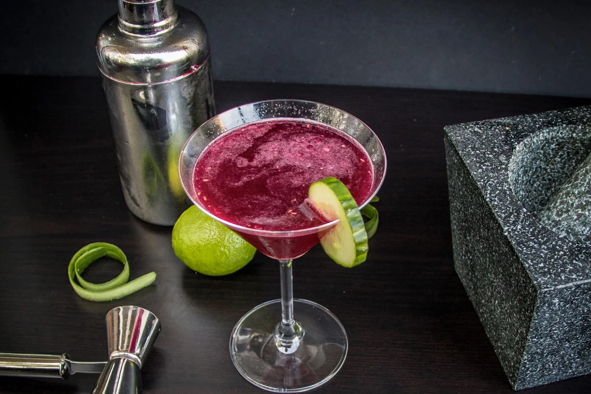 Homemade cucumber and lime vodka with beetroot and coriander syrup