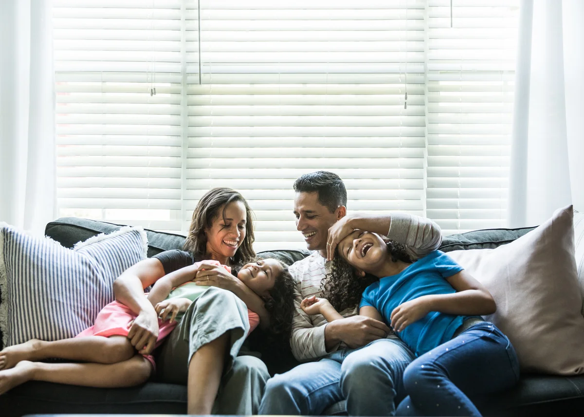 young family on sofa