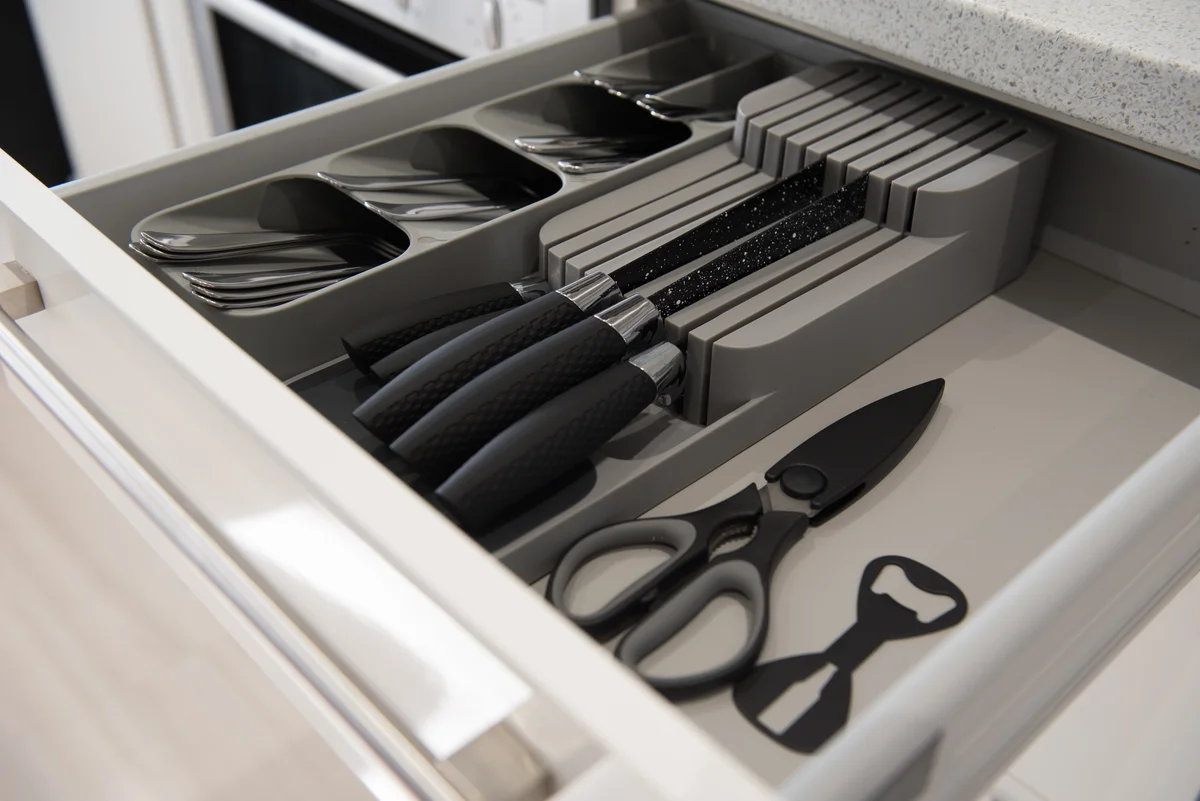 A kitchen cutlery drawer with kitchen knife holder