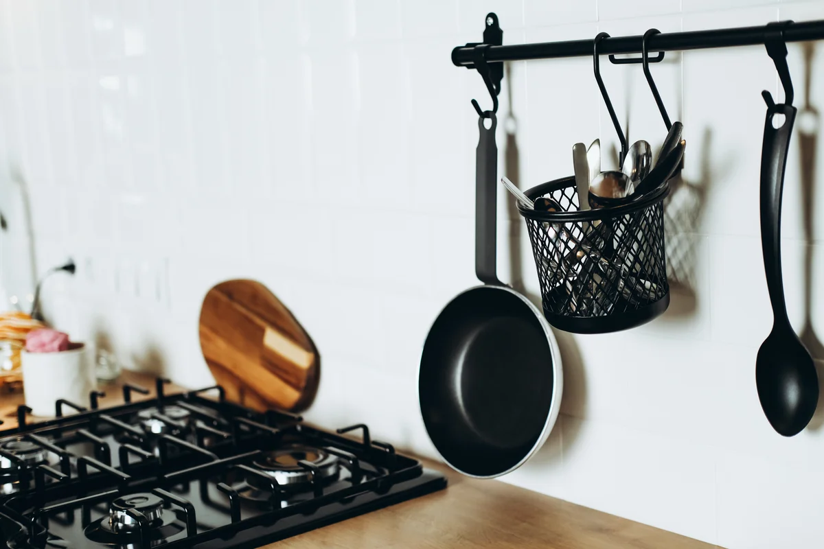 storage basket hung near cooktop