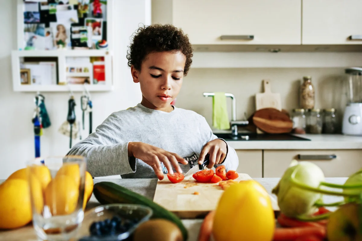 young boy doing meal prep