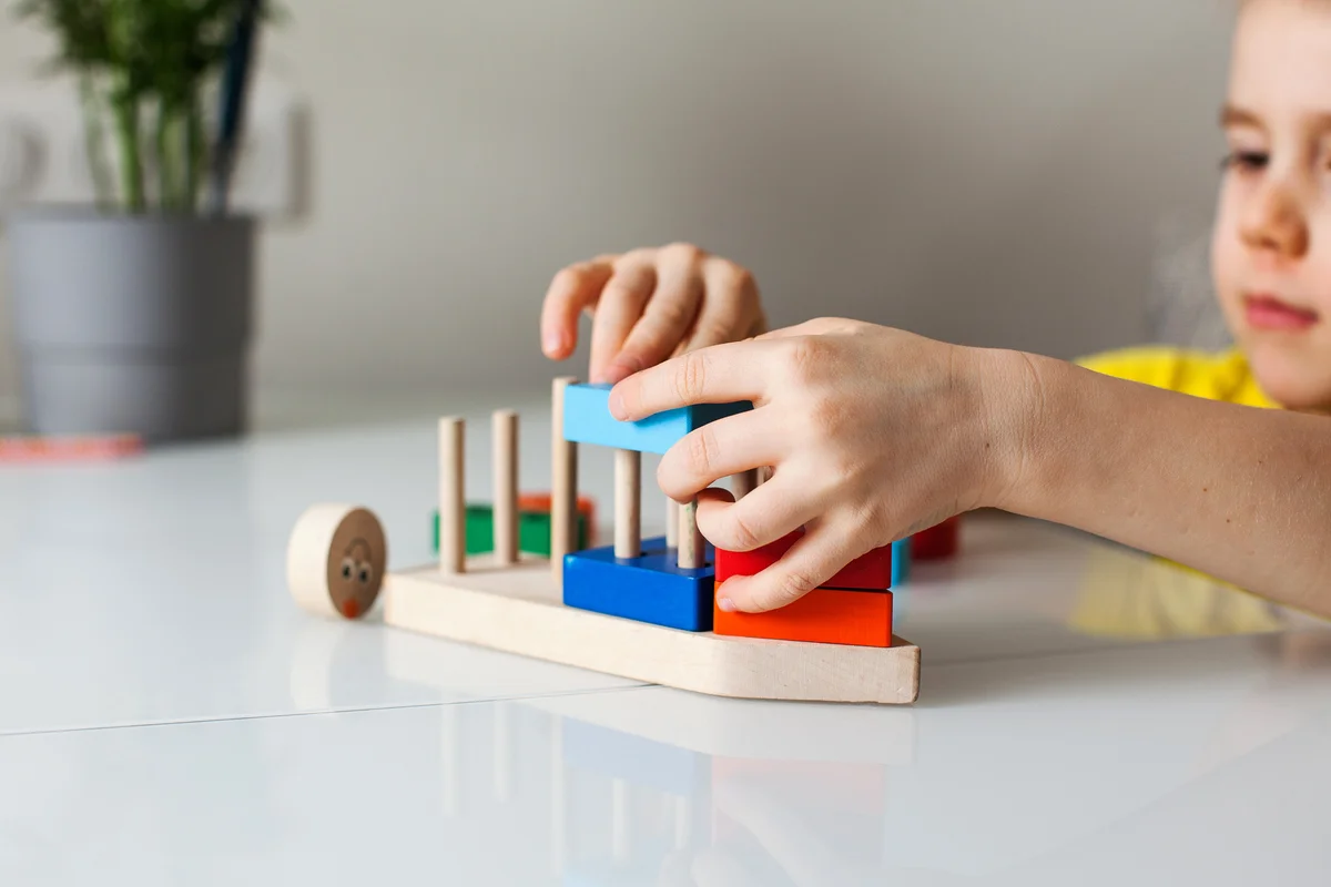 boy playing with puzzle toy