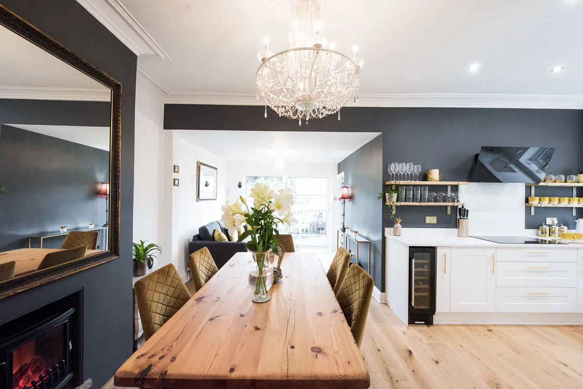 A open plan kitchen diner with white shaker style kitchen
