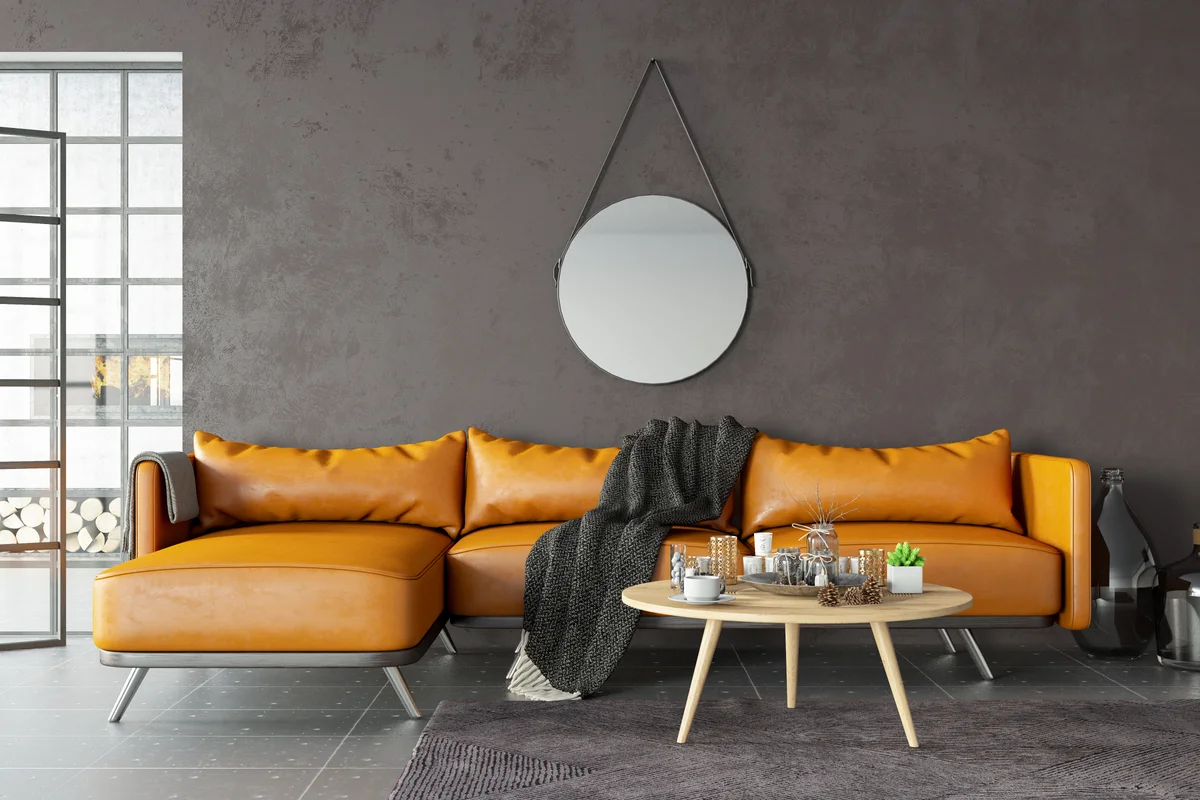 leather sofa against espresso brown wall