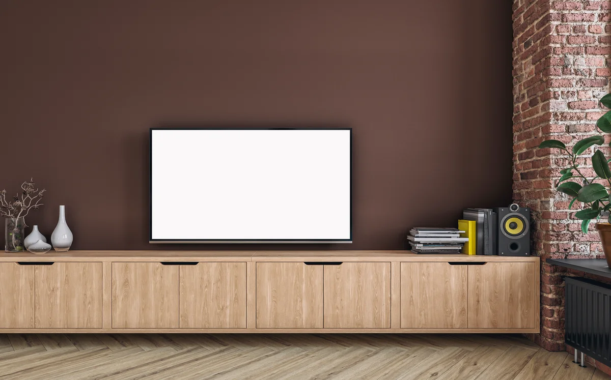 Television against mocha brown wall