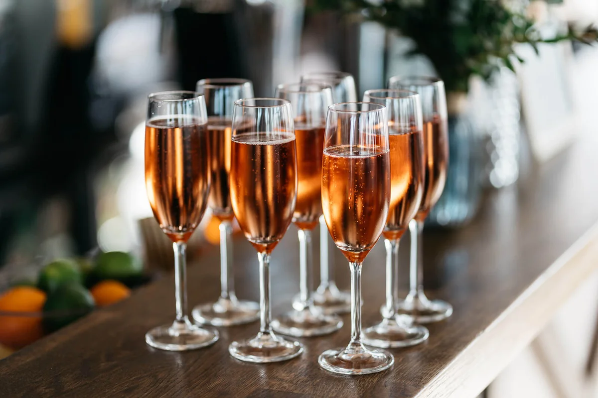 Champagne glasses with rose prosecco