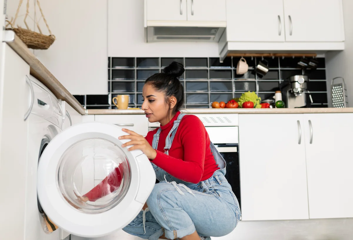 woman using washing machine