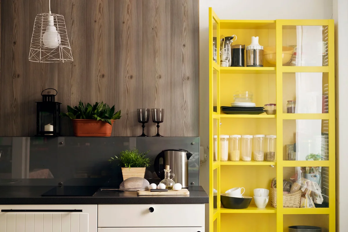 Yellow cabinet by kitchen counter at home