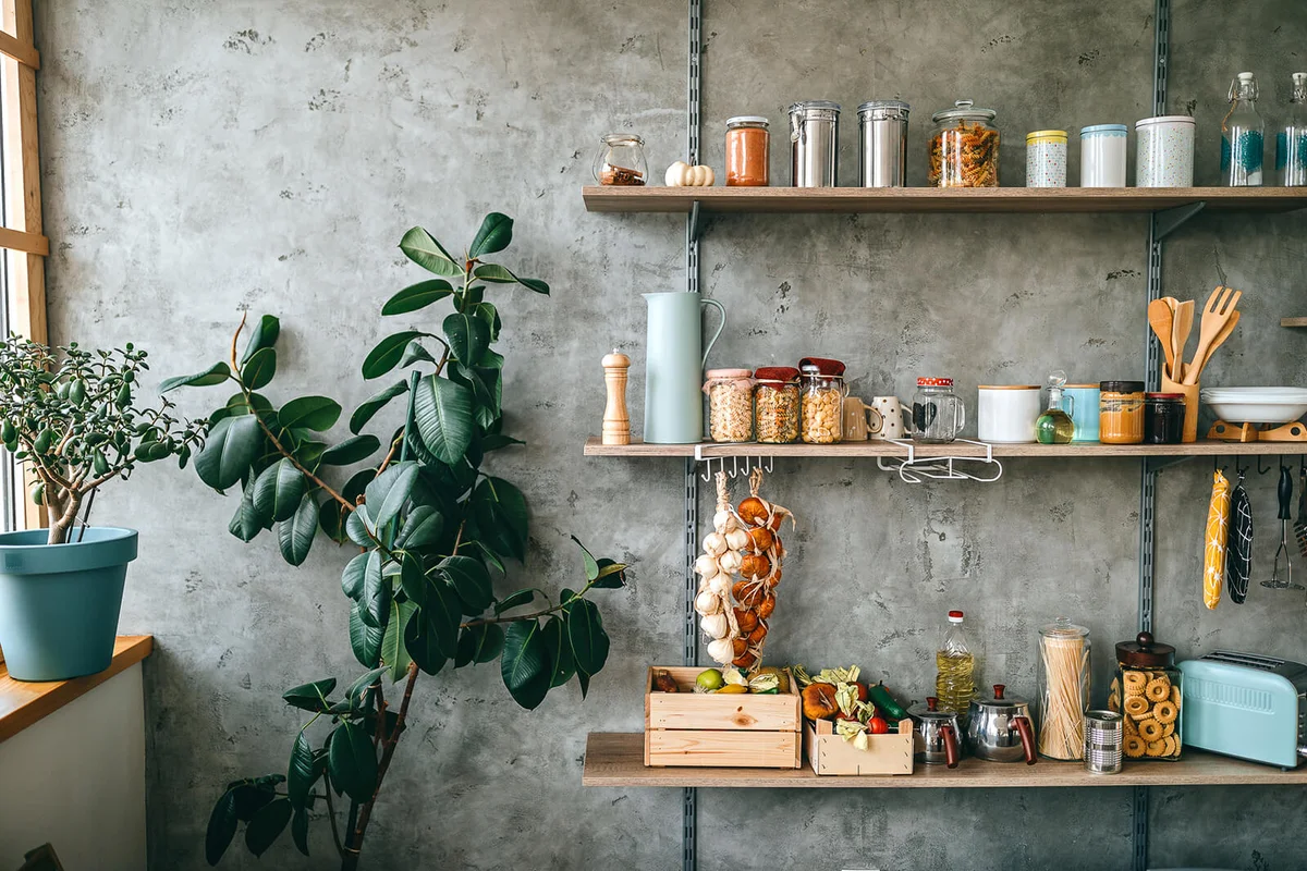 Groceries in glass jars arranged on wooden shelves