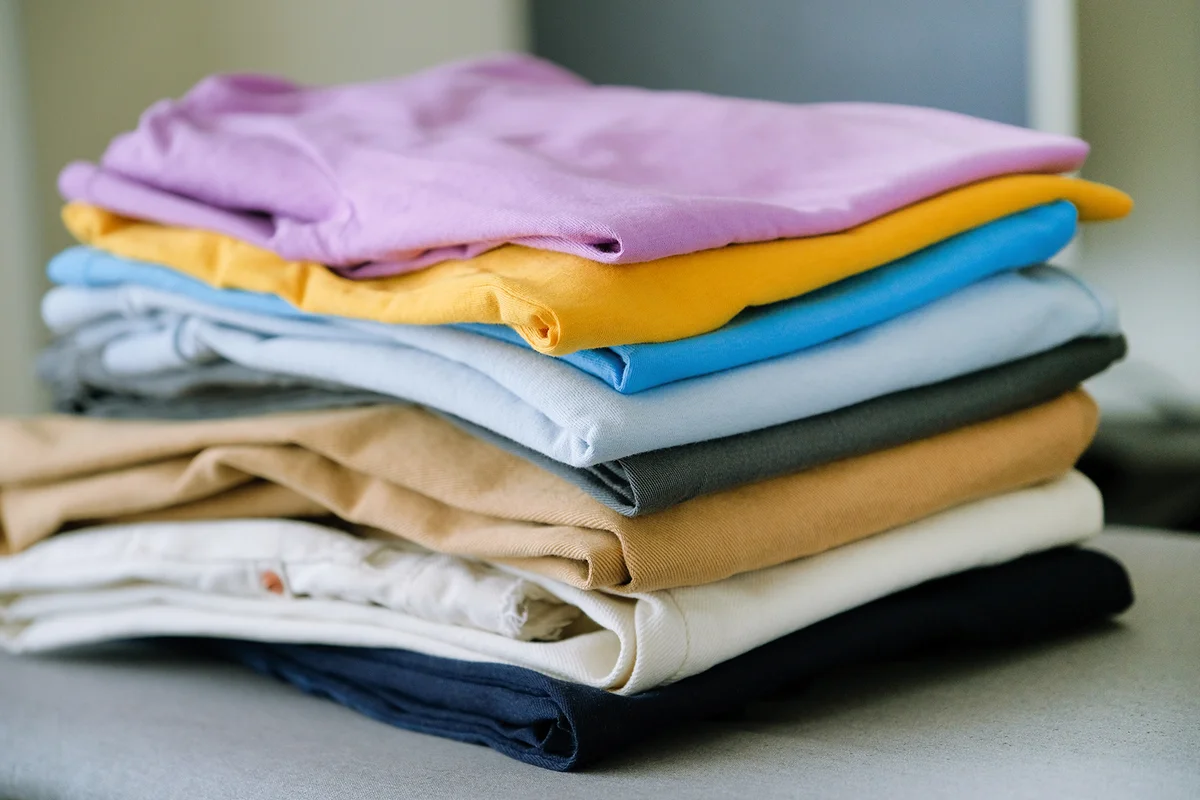 Clean folded cotton denim and bright colored T-shirts
