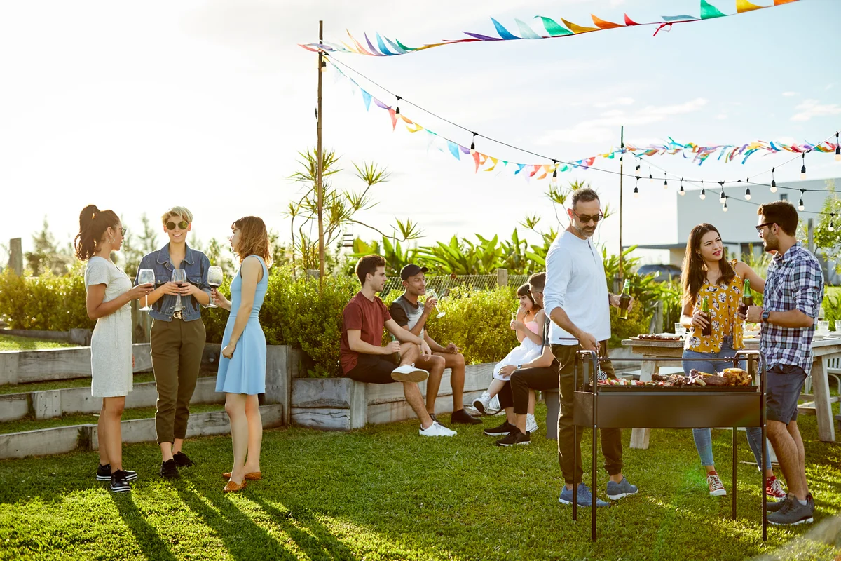 people socializing at a tiki cookout