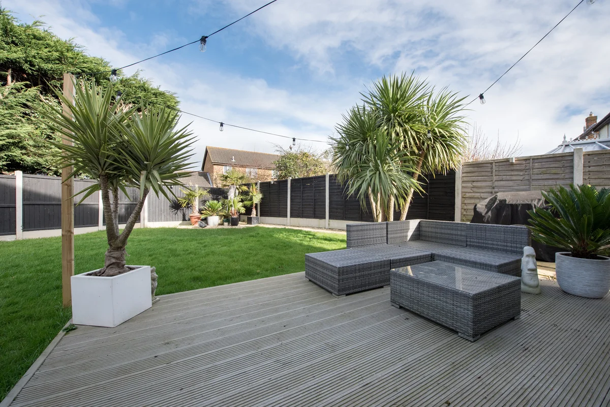 backyard with potted palm trees