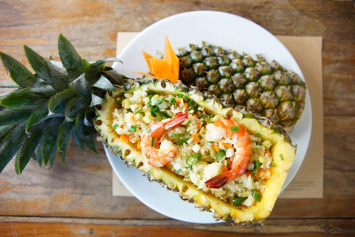 pineapple bowl filled with shrimp fried rice
