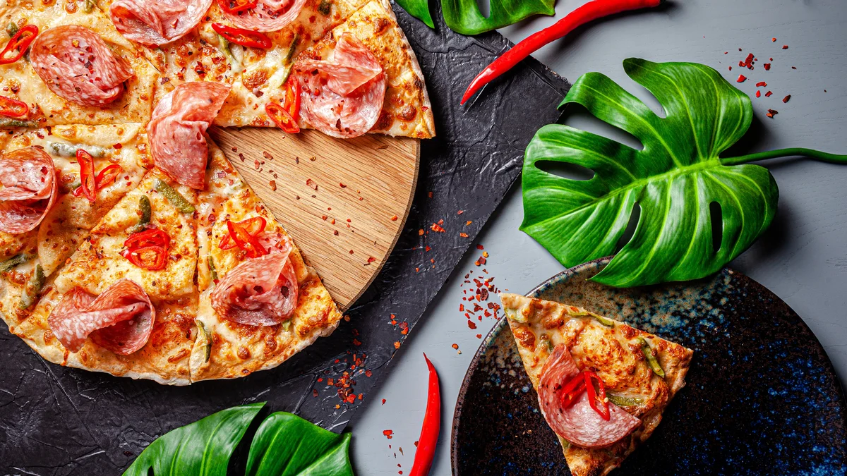 pizza with palm leaves