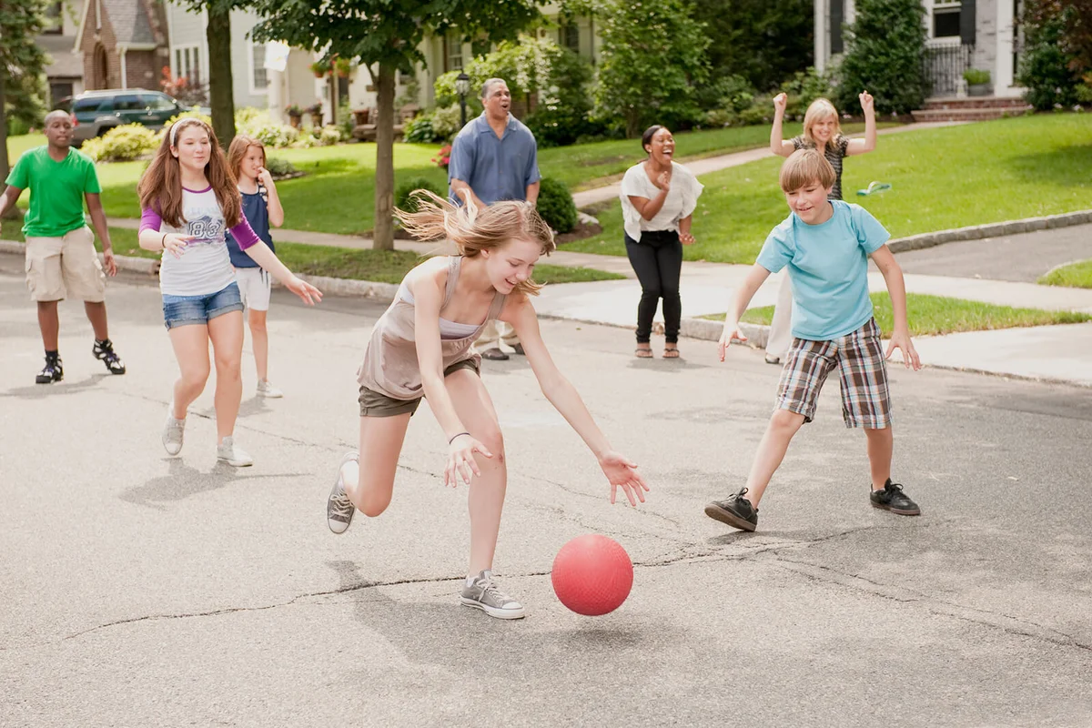 Kids Playing kickball in a Suburban Neighborhood
