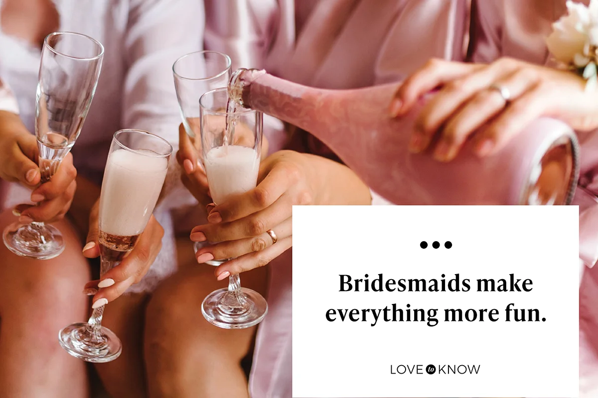 Young bridesmaids clinking with glasses of champagne