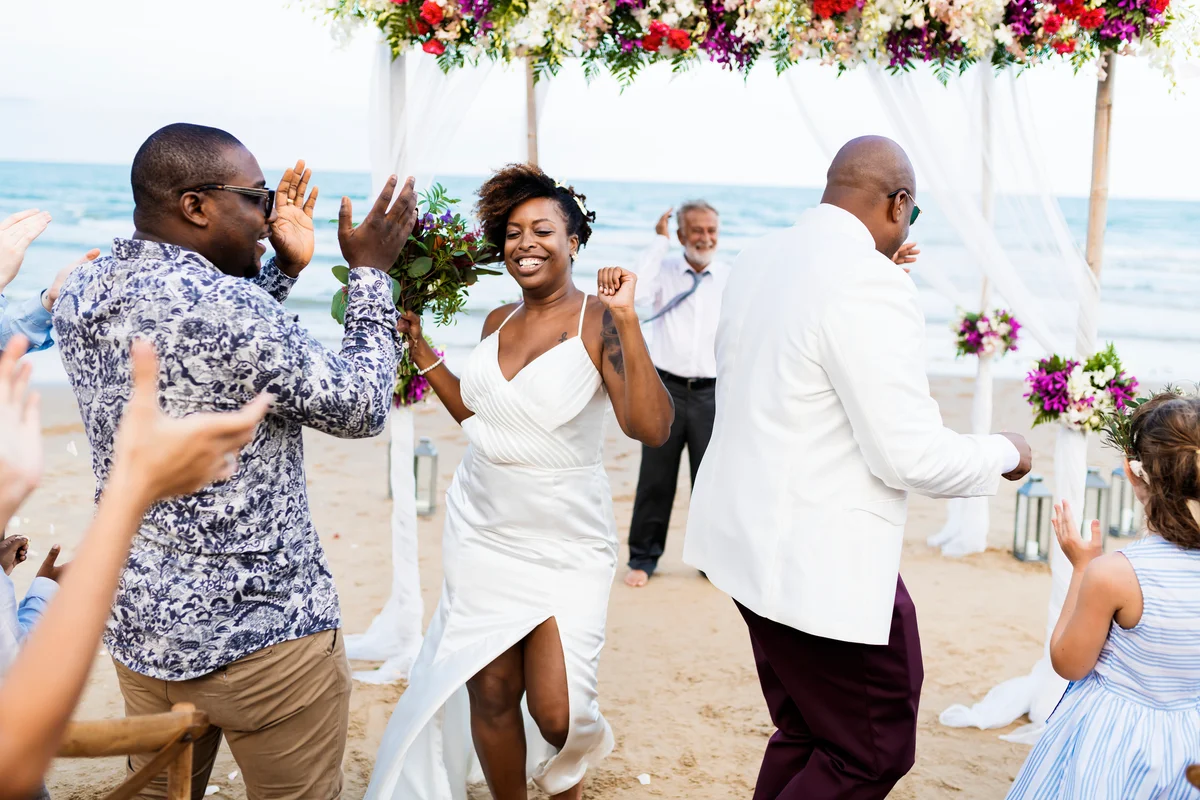 couple dancing with guests at wedding