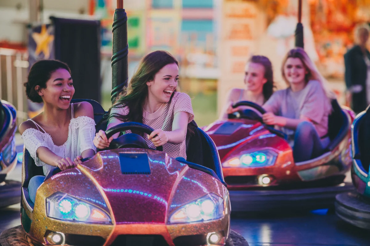 Teens at amusement park