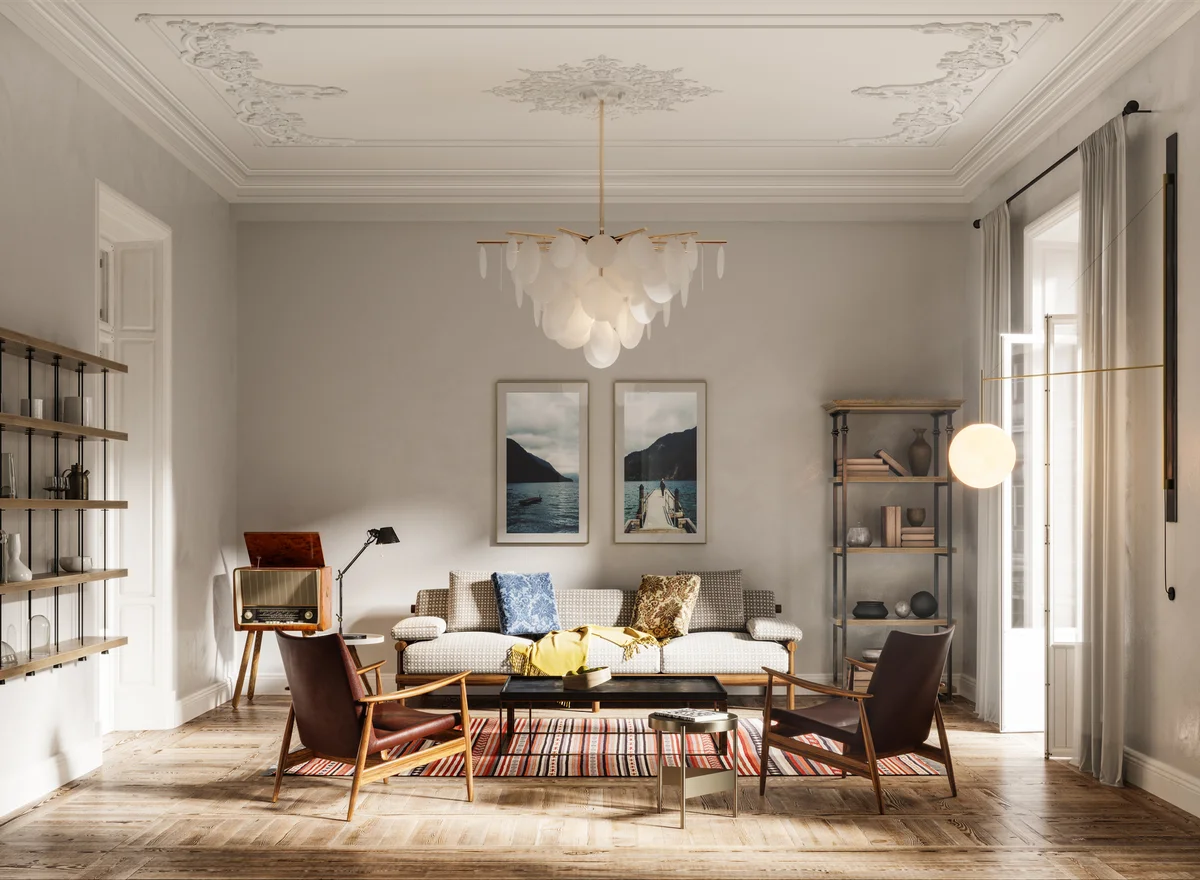 living room with sofa set, arms chairs, wall paintings and beautiful chandelier.