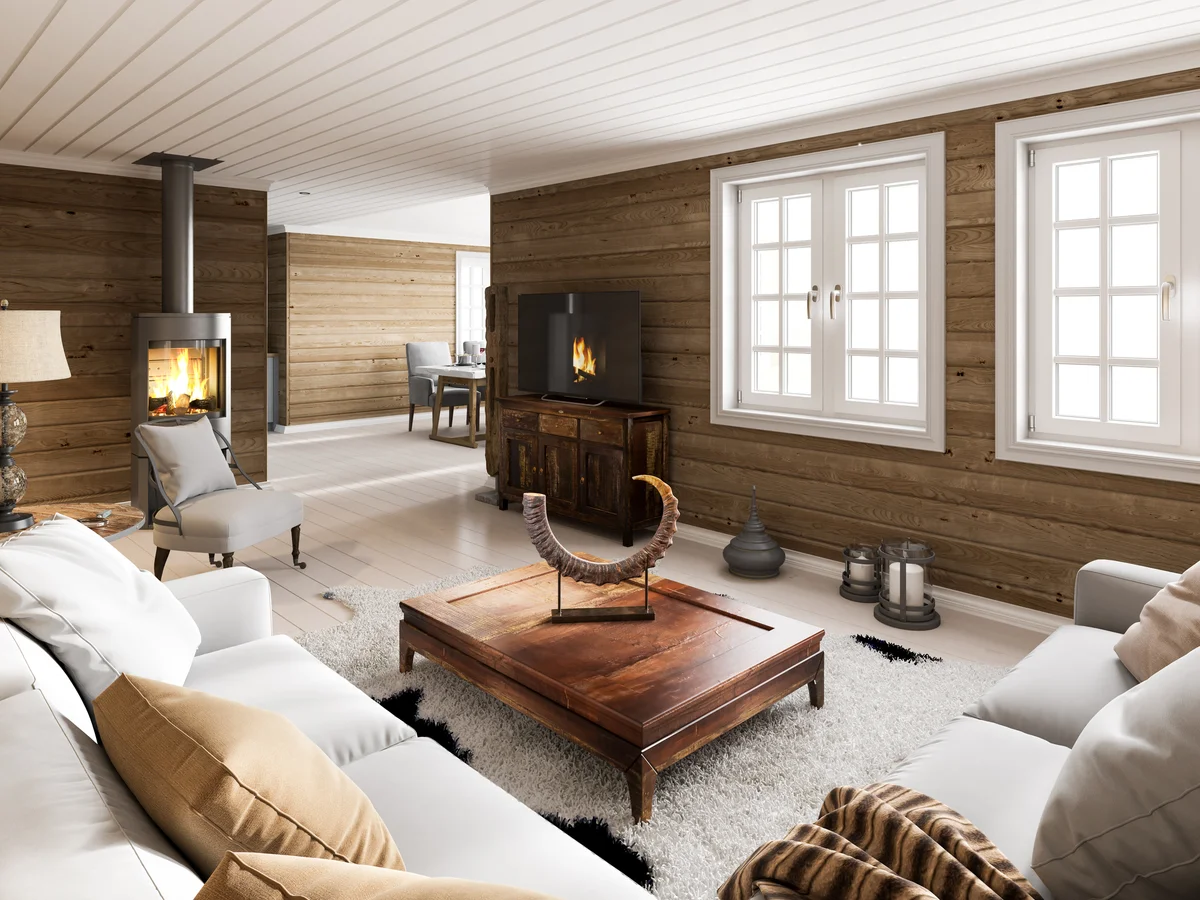 Wooden house interior with fireplace.