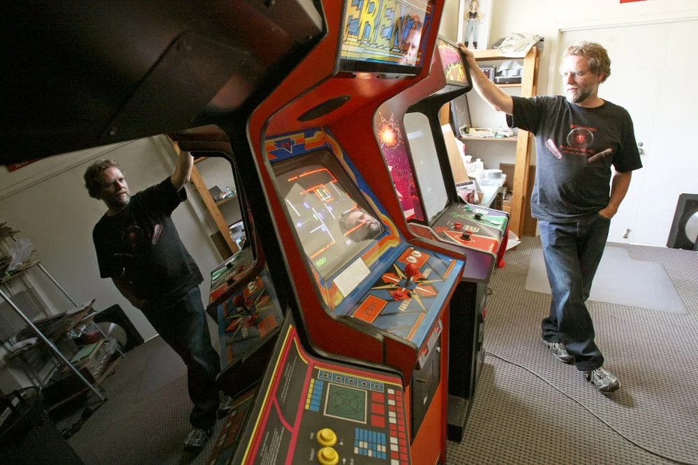 Dale Luck with arcade games collection