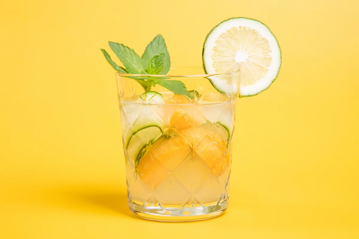 summer lemonade cocktail drink with fresh lime and mint