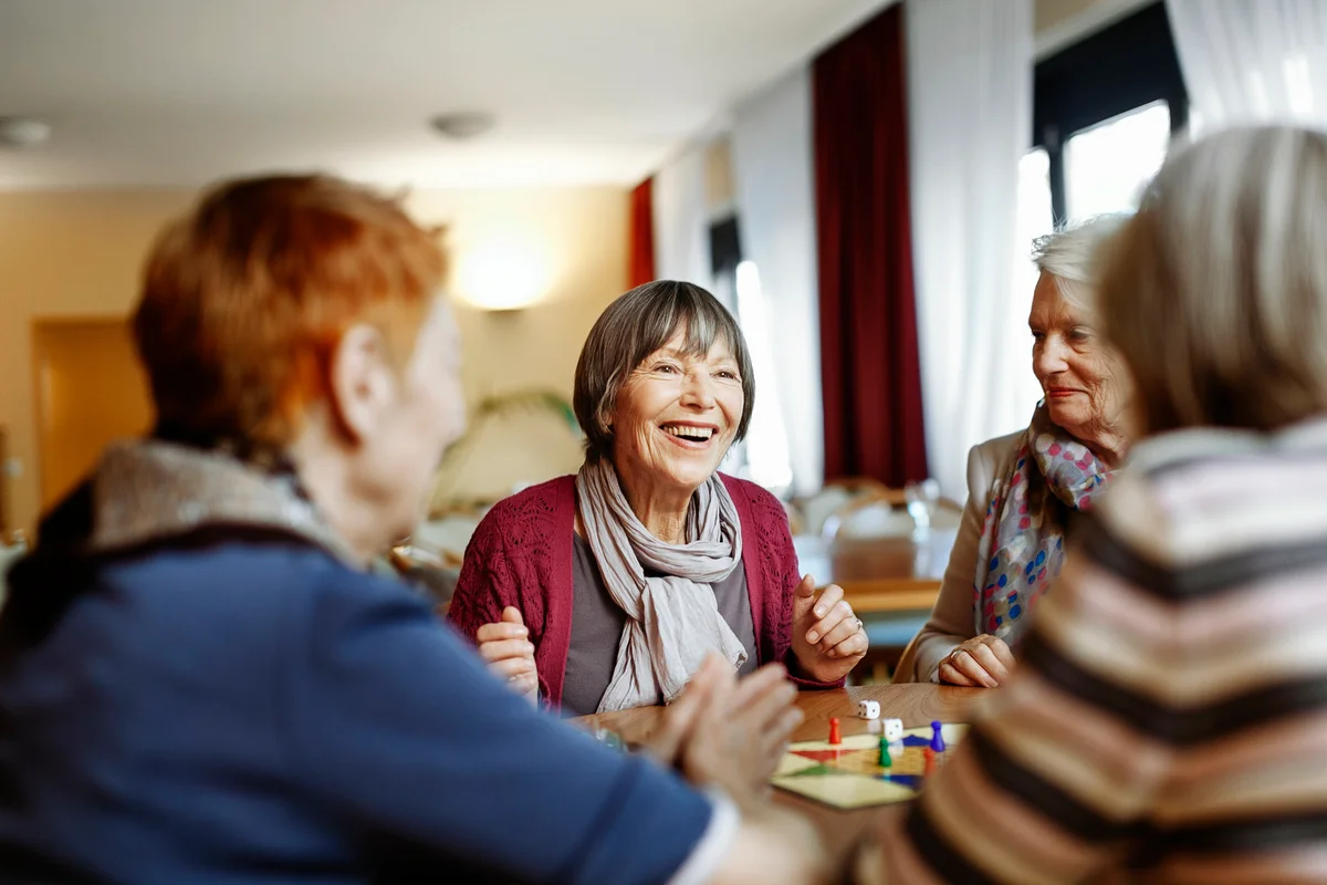 senior women playing a game in senior center