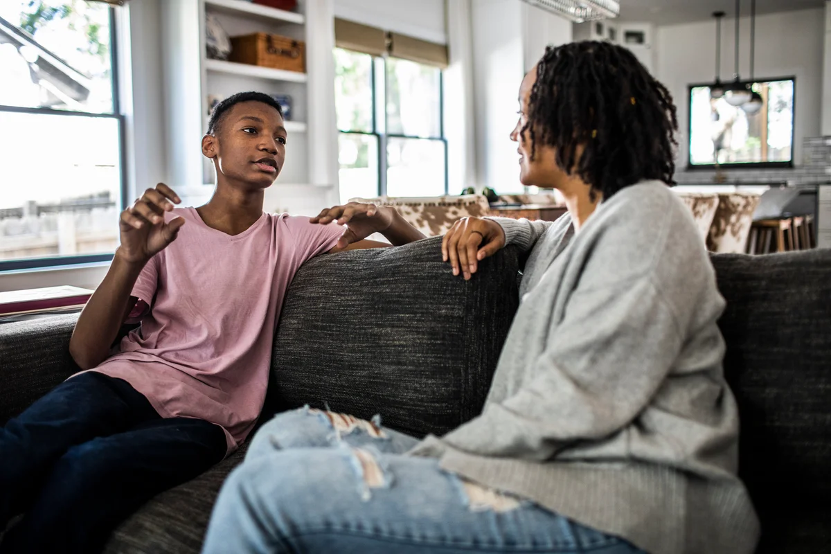 Woman having discussion with son