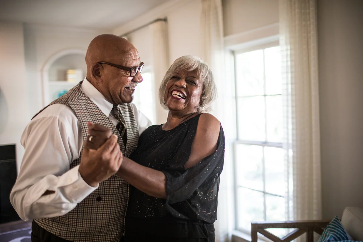 Couple laughing and dancing