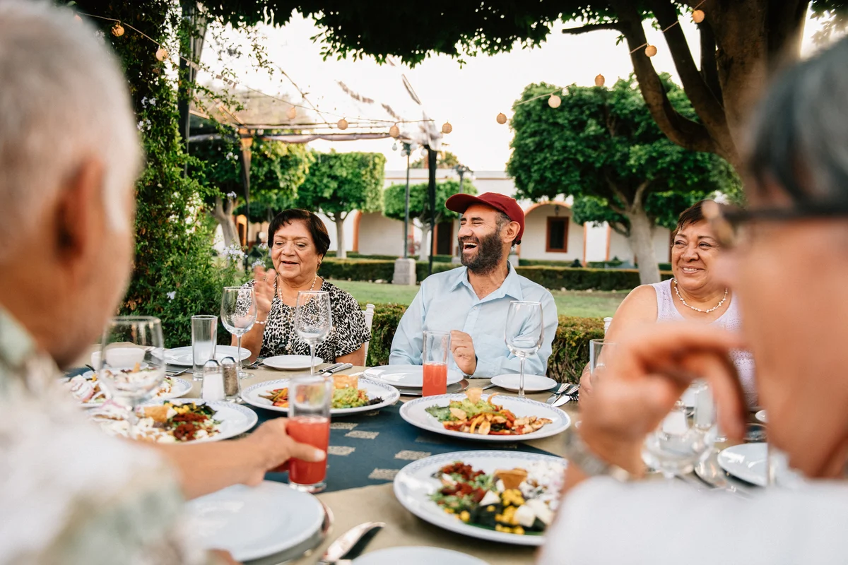 people laughing at picnic table