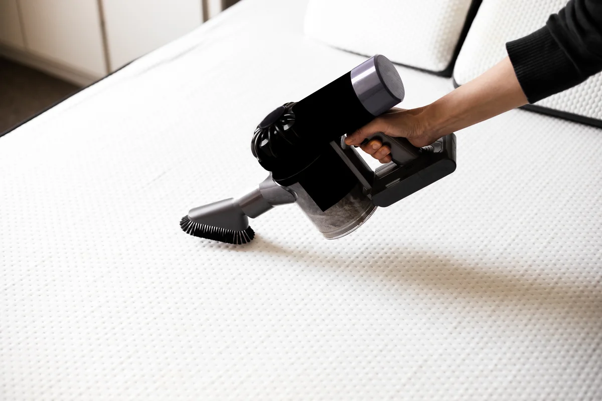 vacuuming a mattress
