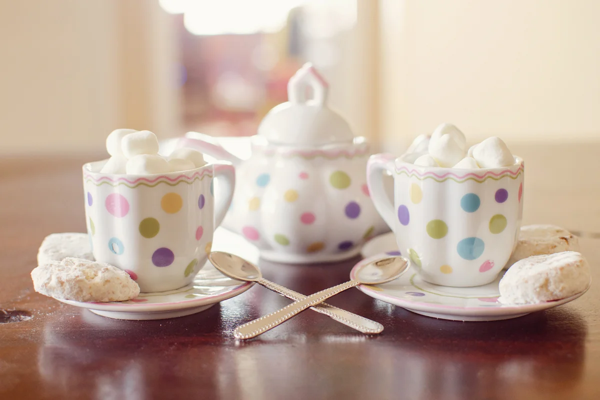Tea and cookies are ready for a party with cute polka dot tea set.