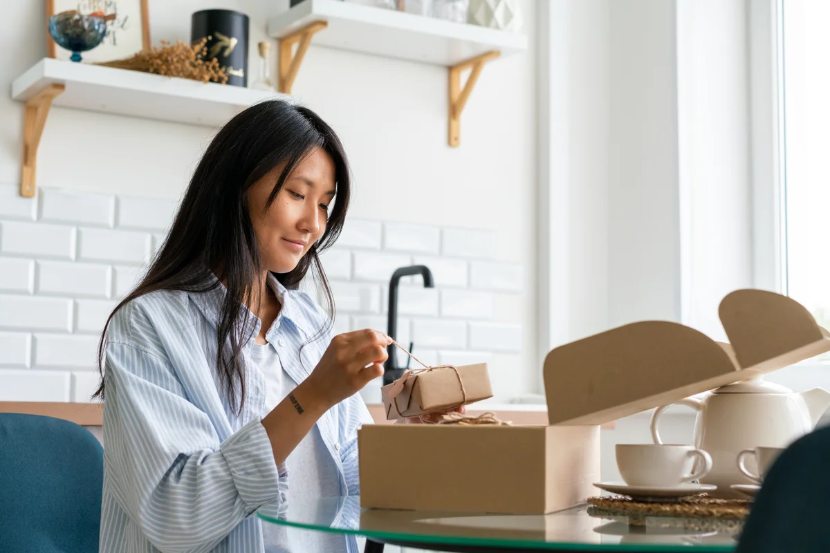 Woman opening gift box